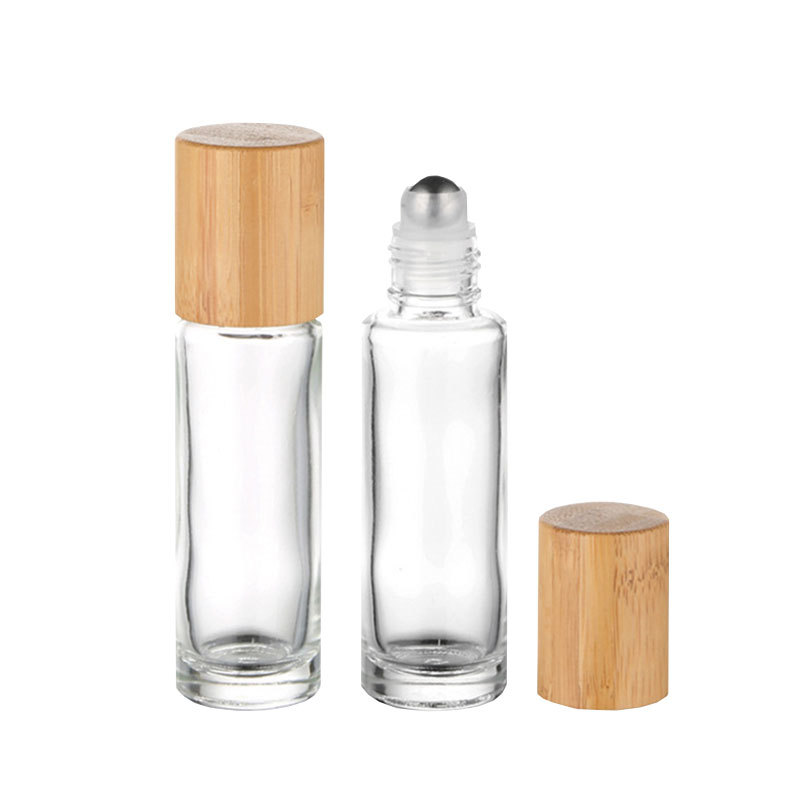 Clear glass roll-on bottle with bamboo and wood lid