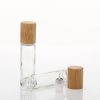 Luxury custom skincare products packaging hot sale empty clear essential oil glass bamboo perfume bottle with bamboo lid metal ball