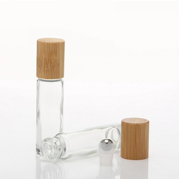 Luxury custom skincare products packaging hot sale empty clear essential oil glass bamboo perfume bottle with bamboo lid metal ball
