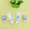 Cosmetic Packaging for Essence Oil Applicator with Brush Tip and Plastic Drip Head for Skin Care Massage Oil featuring Screw Cap